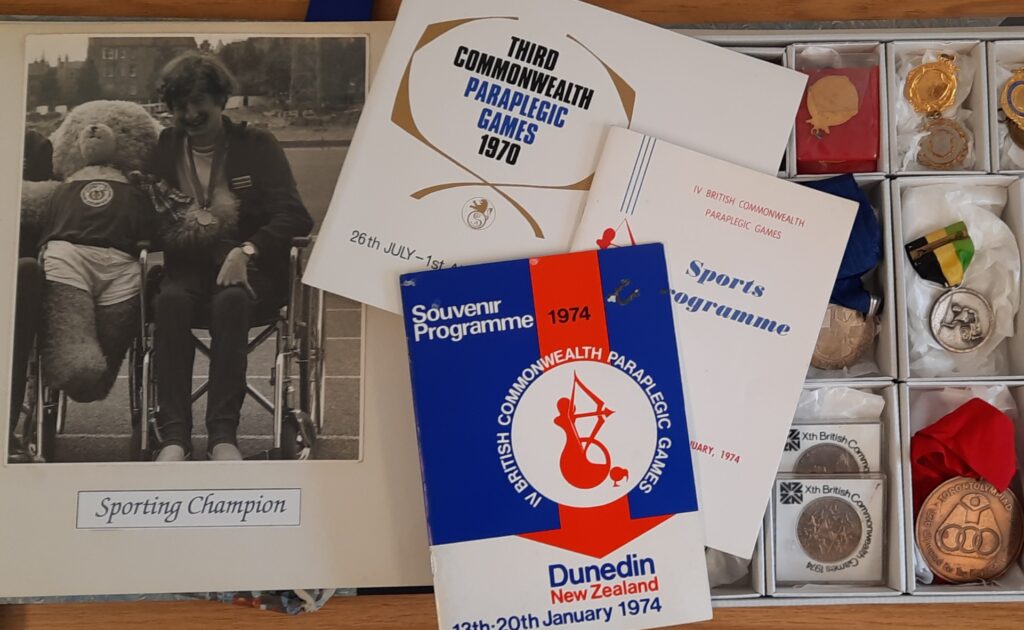 A collection of memorabilia related to the Commonwealth Paraplegic Games in the 1970s including medals, programmes and photographs.