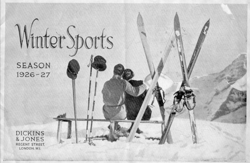Advert for winter sports showing two people sitting on a bench in the snow with skis.